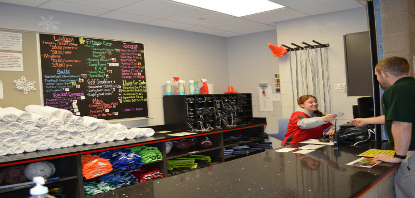 Student at desk of equipment checkout